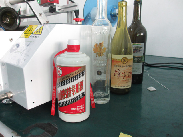 labelled bottle samples by transparent labels red wine bottl