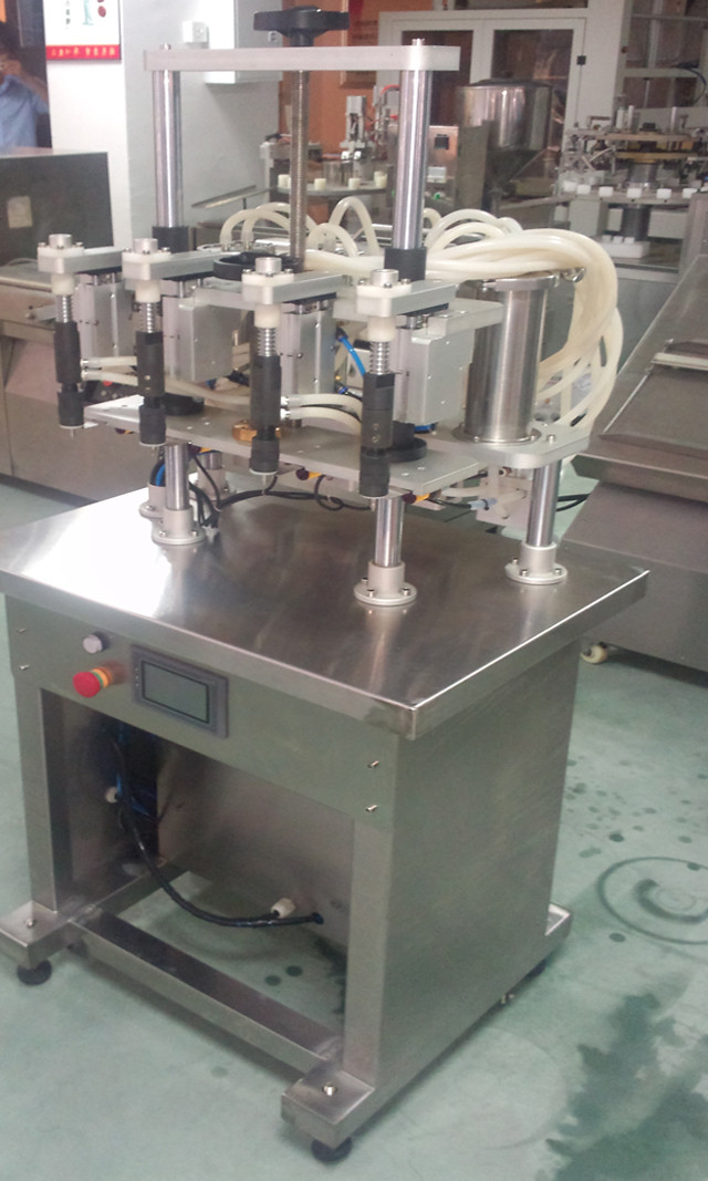 close-up photo of 4 heads Semi-automatic Filling Machine for