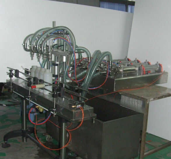 full view of four heads pneumatic filling machine semi autom