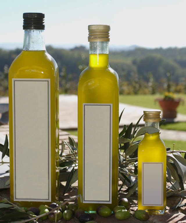 capped olive oil bottles by automatic olive oil filling line