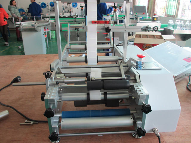 full view of syringe labeling machine benchtop labeler equip
