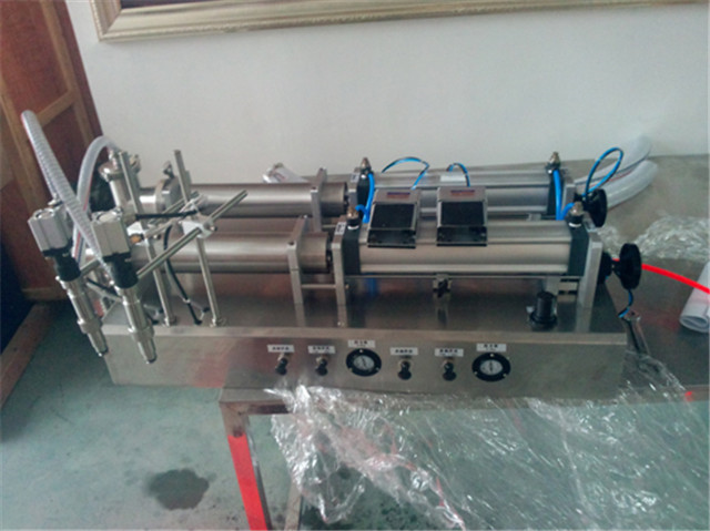 Algerian customer ordered YX-F2-1000 double head pneumatic piston filling machine 500ml lotion filler for shampoo,oil,water,perfume,water