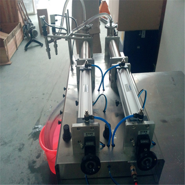 side view of  pneumatic liquid filling machine double head.j