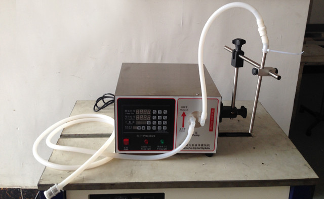 Indonesian customer purchased magnetic pump digital liquid filling machine filler equipment