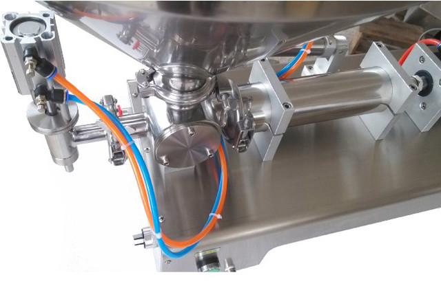 detailed view of pneumatic horizontal liquid paste filling m