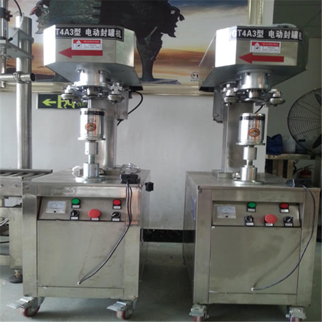 front view of  Can sealing closing machine beer tin cans sea