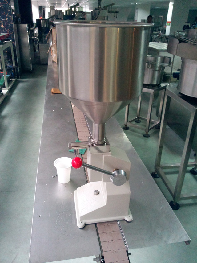 side view of  the manual liquid filling machine hand operate