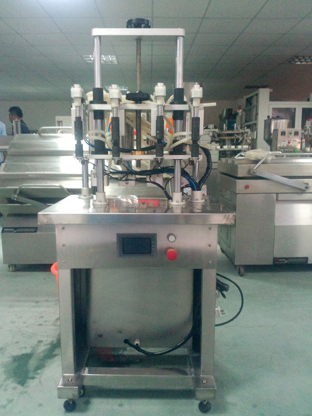 AU customer ordered YX-V04 vacuum liquid filling machine for nail polish perfume liquids