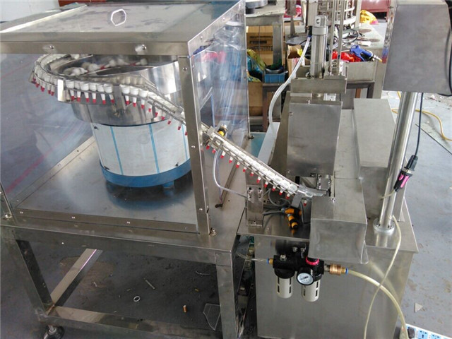 full view of cap wadding lining machine induction sealing wa