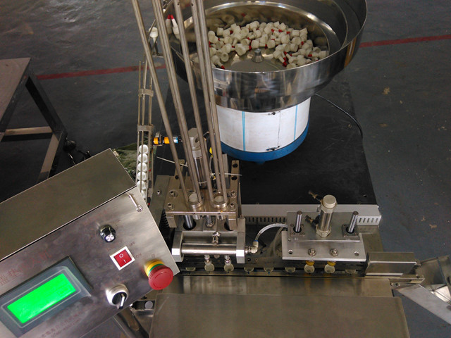 top view of cap wadding lining machine induction sealing wad
