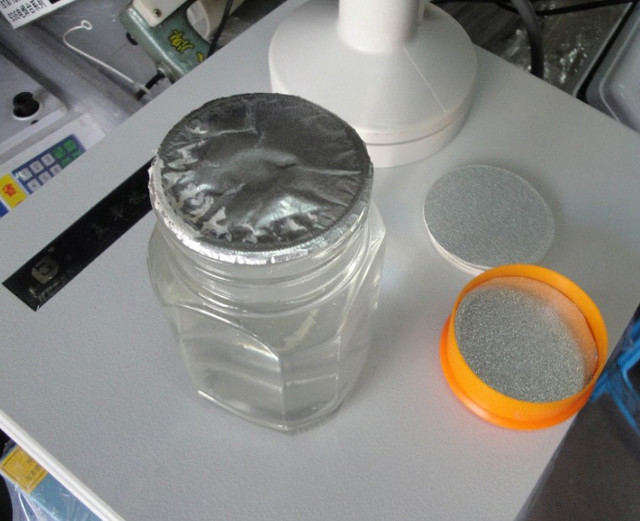 sealed jars by the hand held heat induction cap sealing mach