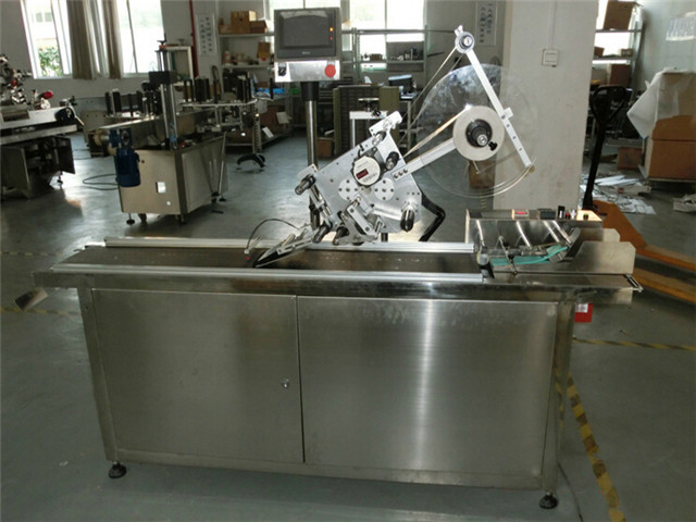 flat surface top labeling machine automatic at  work plant.j