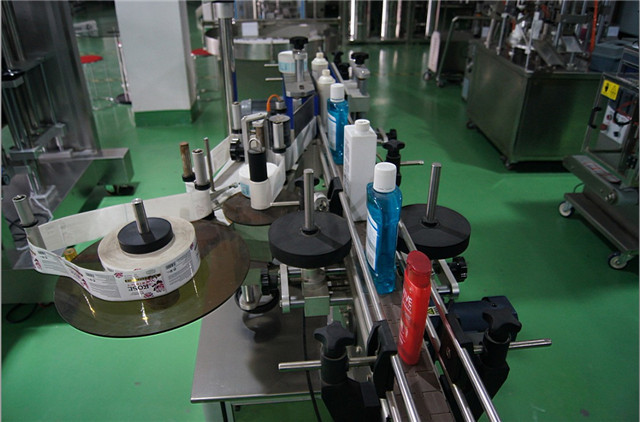 close up photos of round bottles automatic labeling machine 