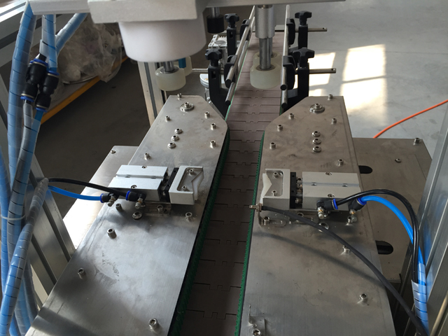 close look at the linear capping machine with bottle sensor 