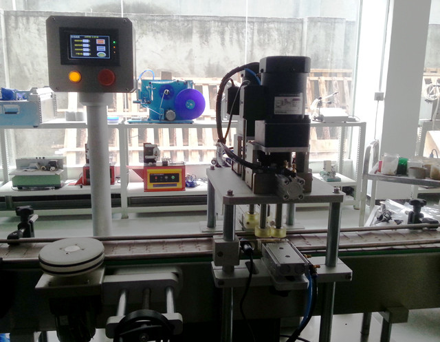 inline screw capping machine with manual feed caps.jpg
